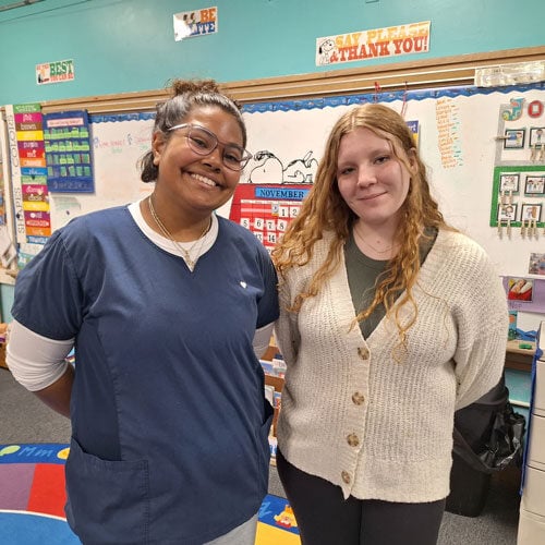 A student and mentor at the Branford Early Learning Center